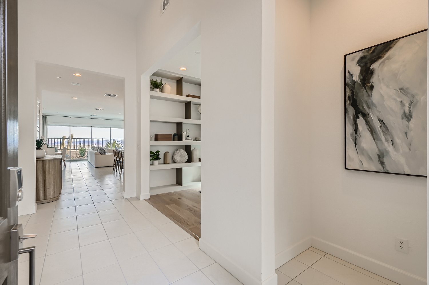 A room with white walls and a white floor with a white tile floor.