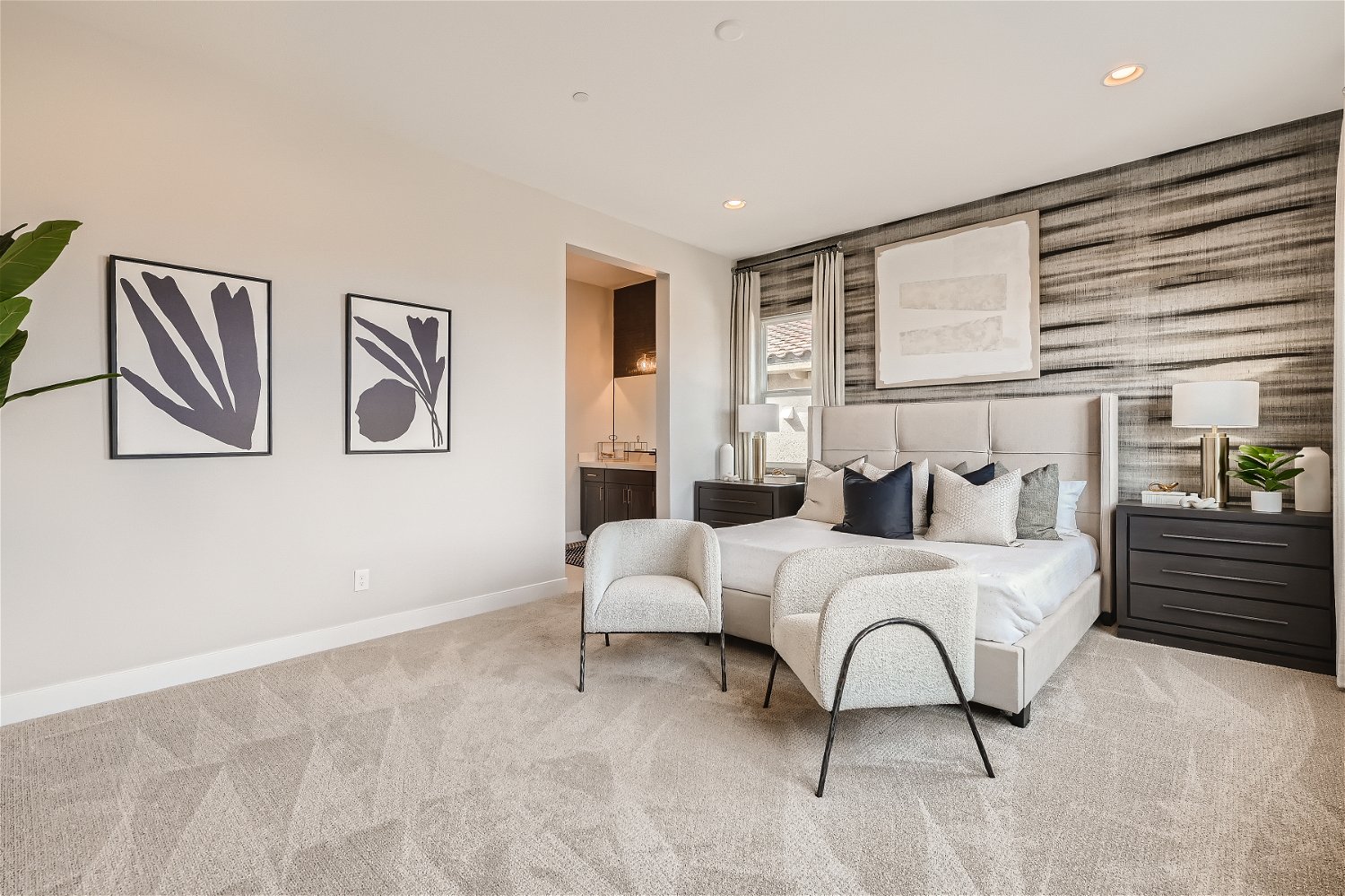 A room with a bed and a chair.