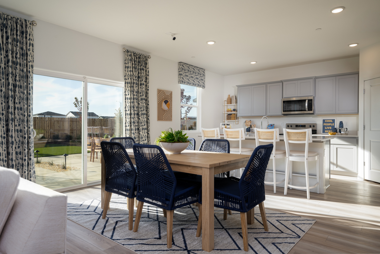 A dining room with a large window.