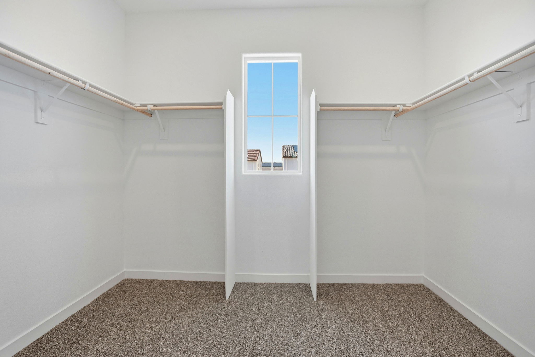 A white room with a window.