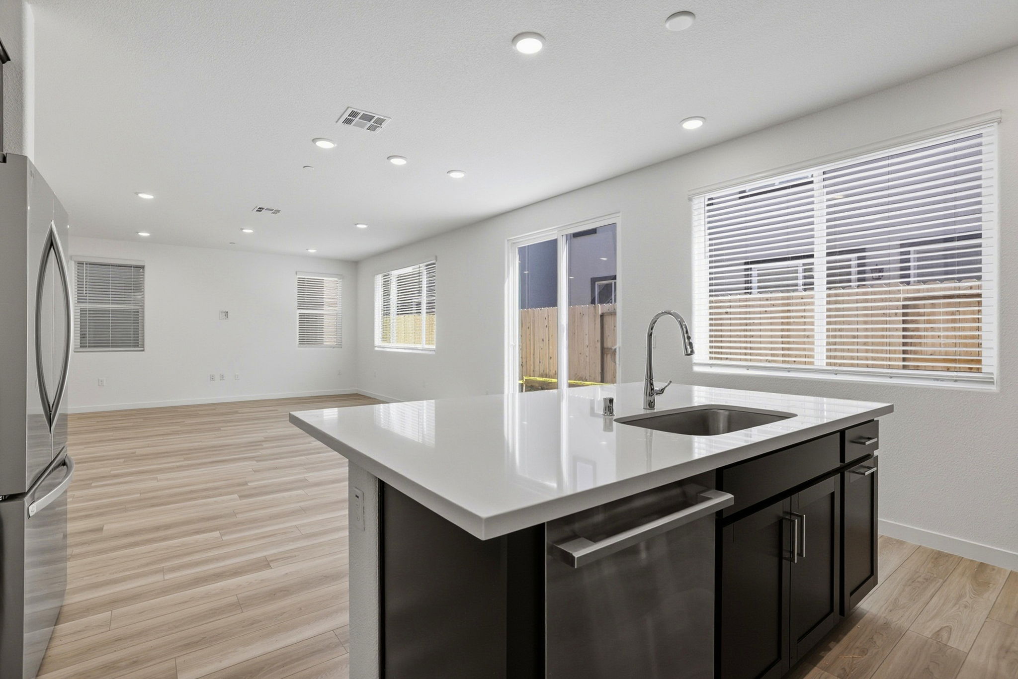 A kitchen with a sink and cabinets.