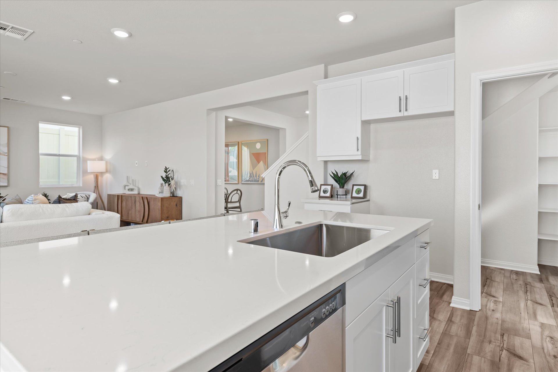 A bathroom with a sink and a bed.