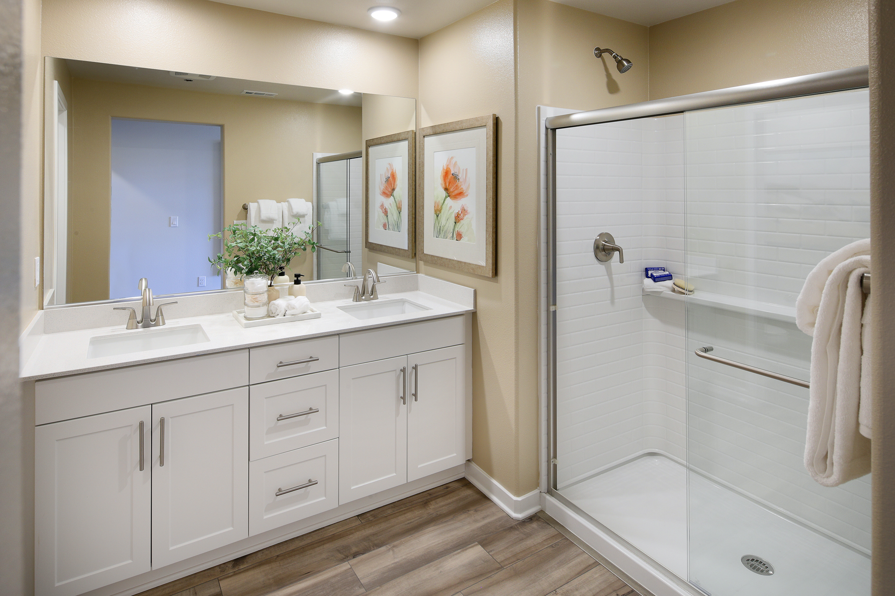 A bathroom with a shower and sink.