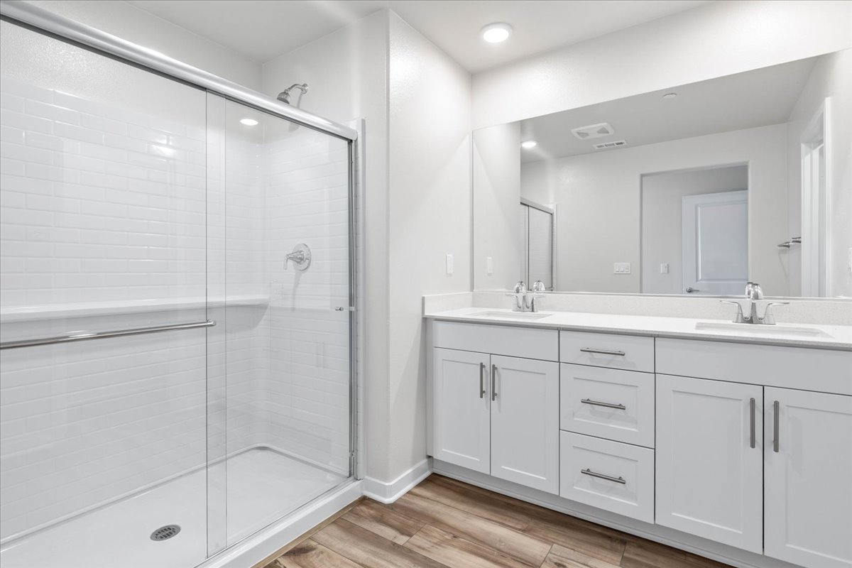 A bathroom with a glass shower.