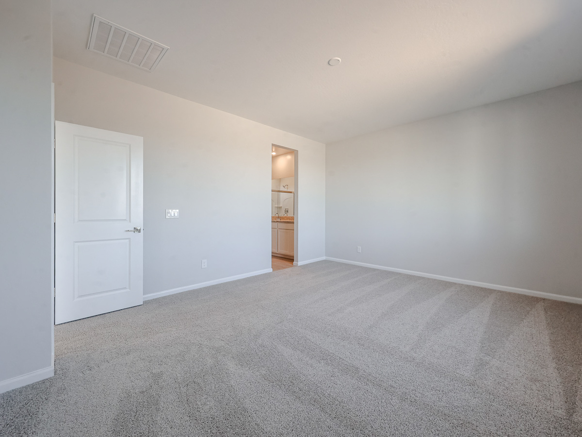 A hallway with white doors.