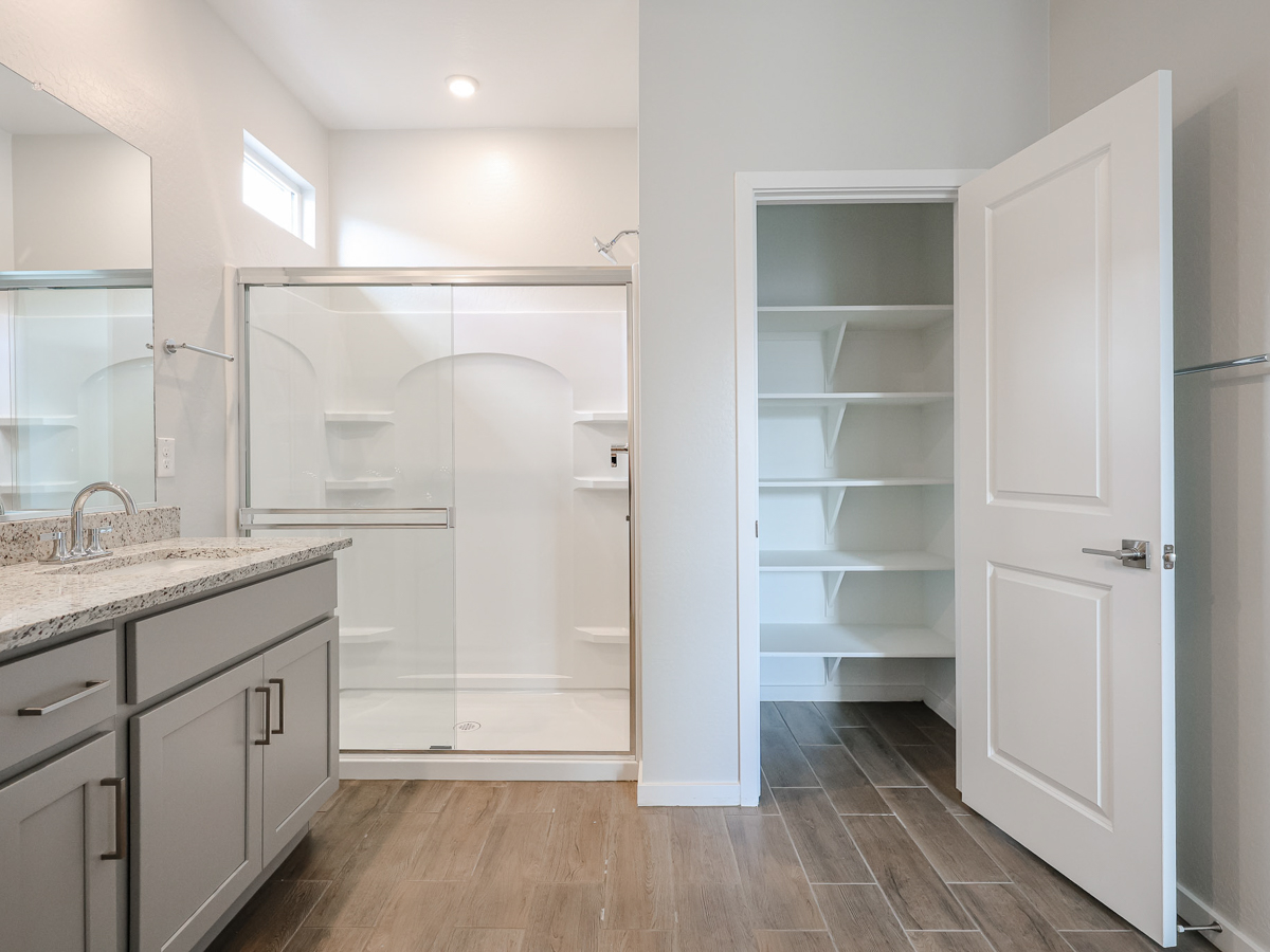 A bathroom with a glass shower.