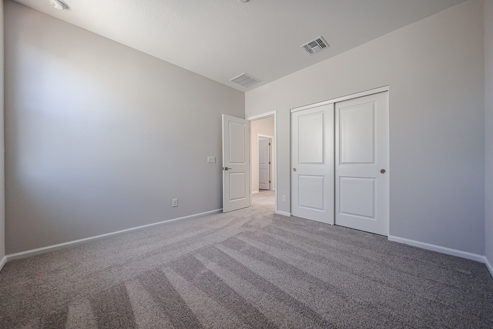 A room with white doors.