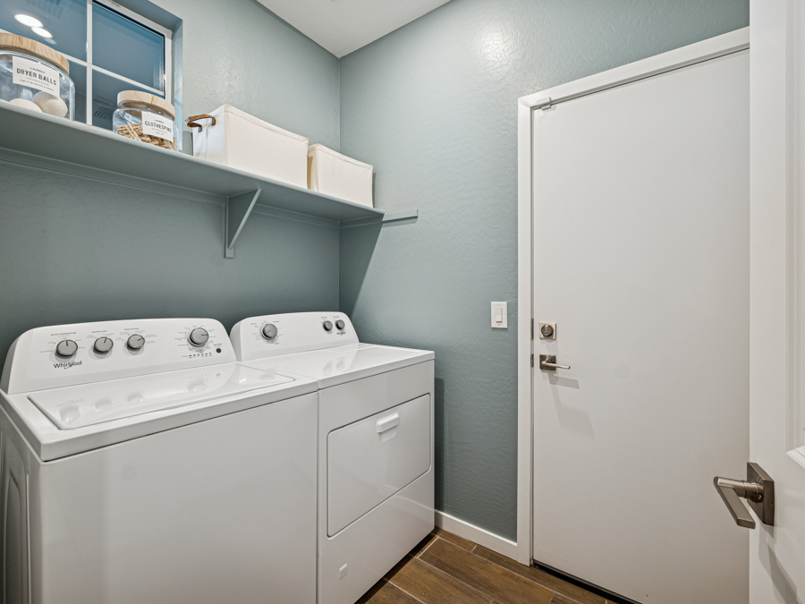 A laundry room with a washer and dryer.