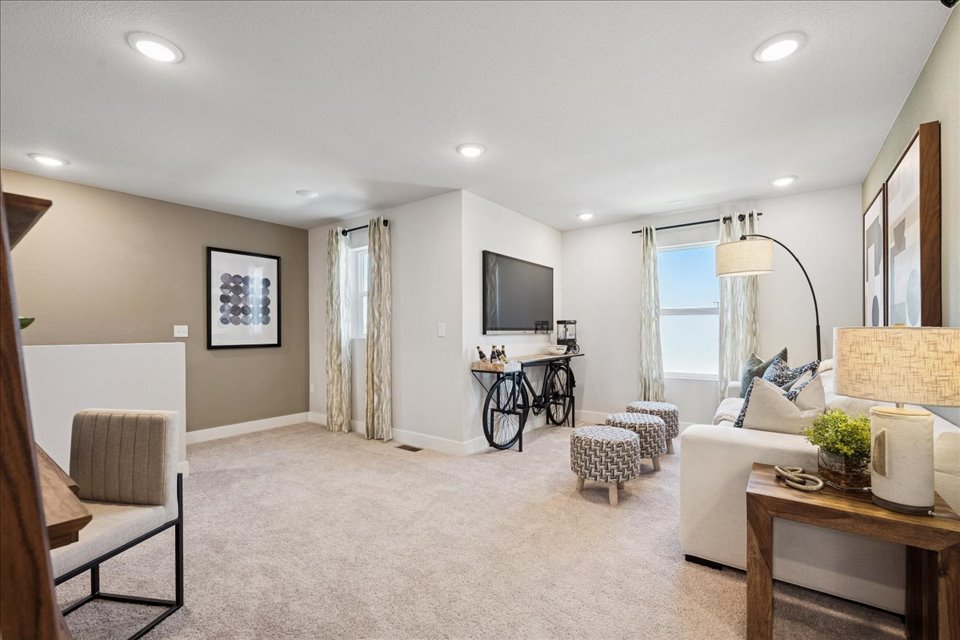 A living room with a couch and a table.
