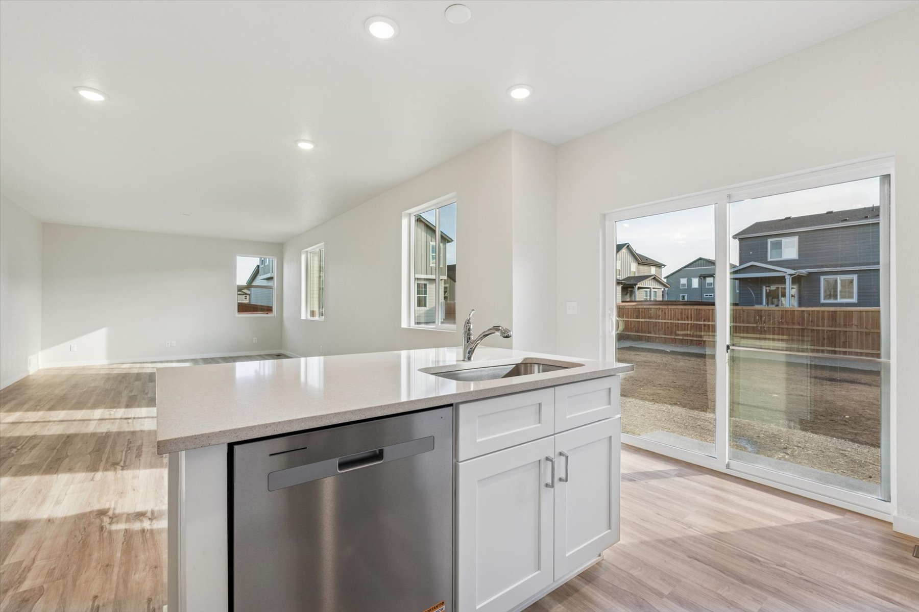A kitchen with a large glass door.