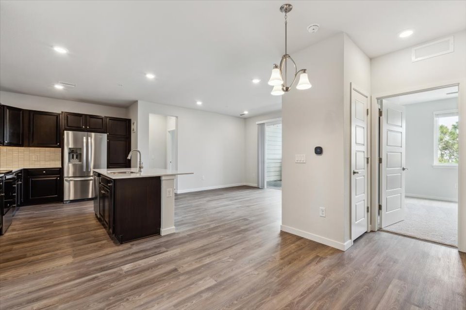A kitchen with wooden floors.