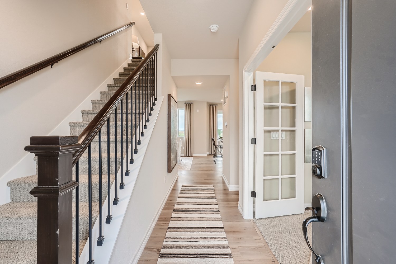 A hallway with white walls.