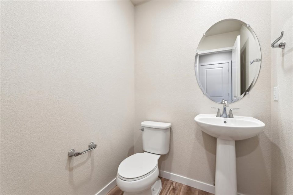 A bathroom with a sink and toilet.