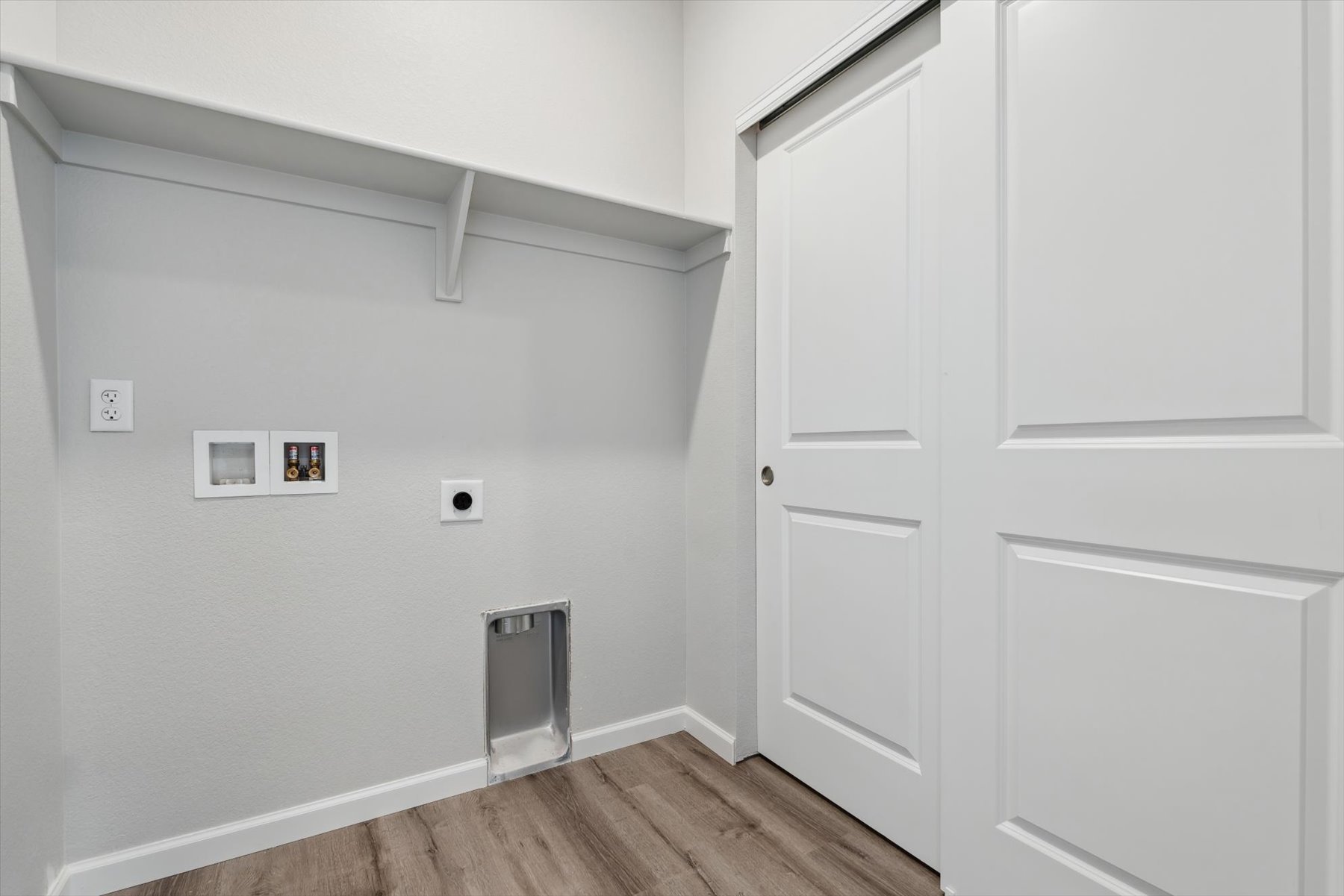 A room with white cabinets.