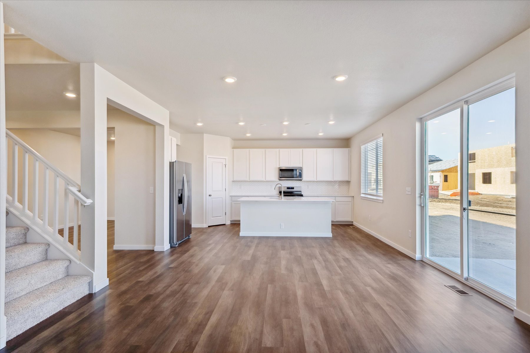 A large kitchen with white cabinets.