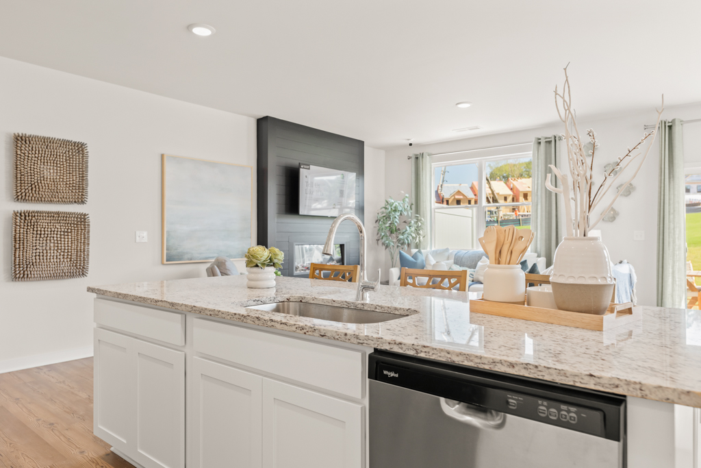 A kitchen with marble counters.