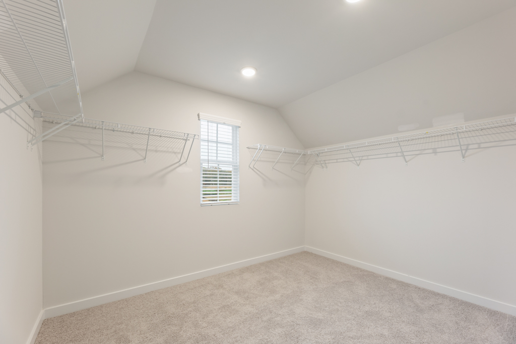 A white room with a staircase.