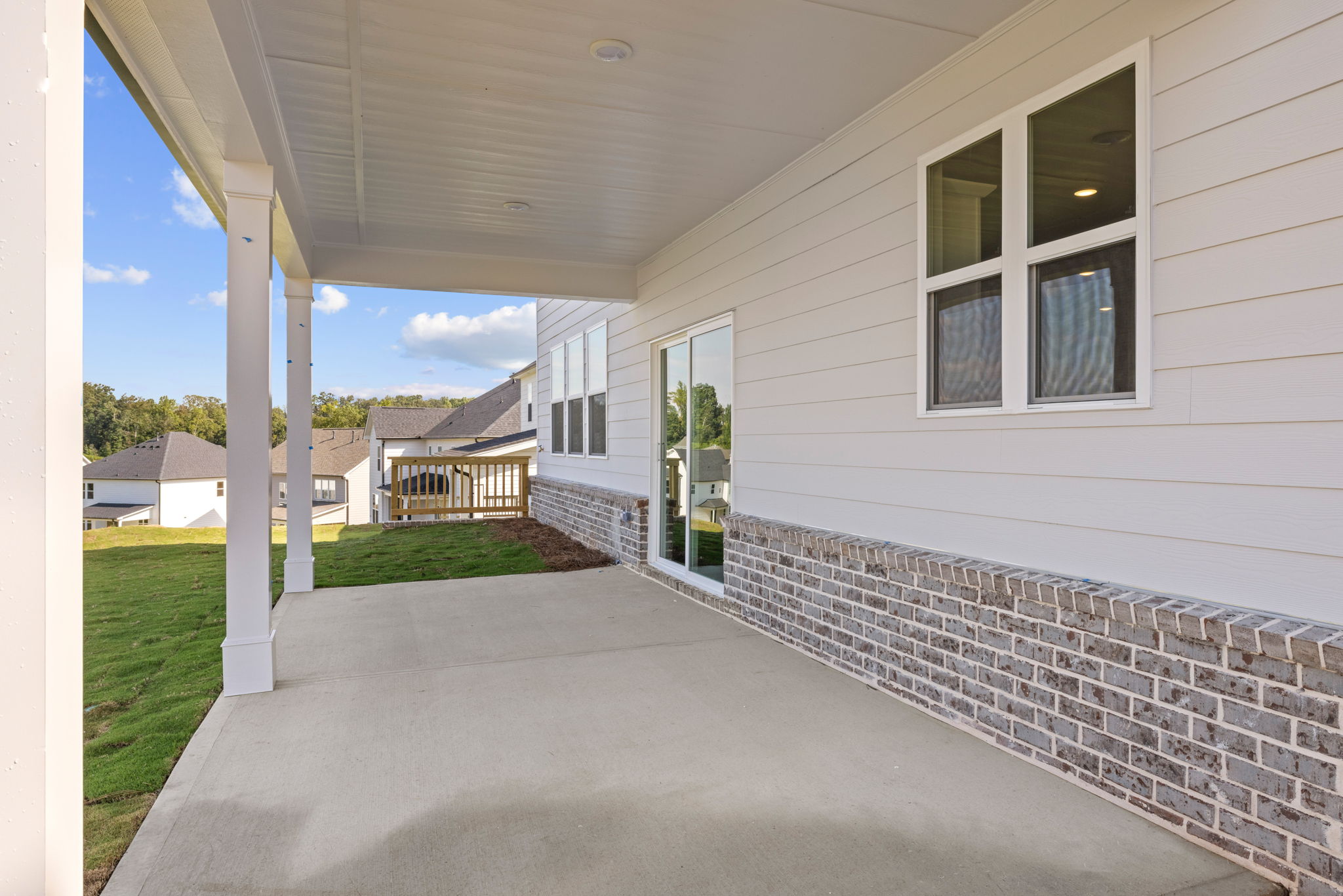 A house with a brick driveway.