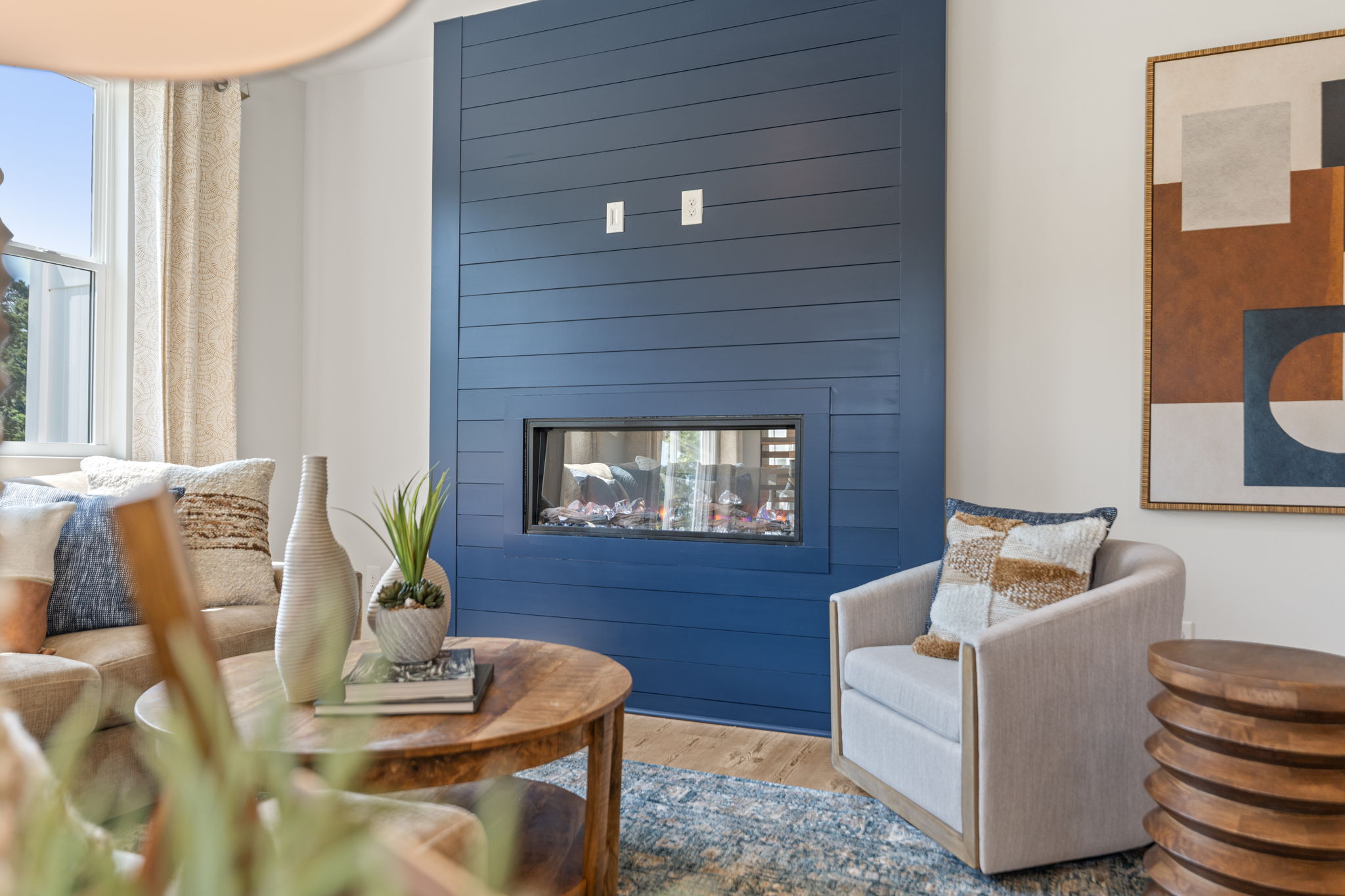 A living room with a fireplace.