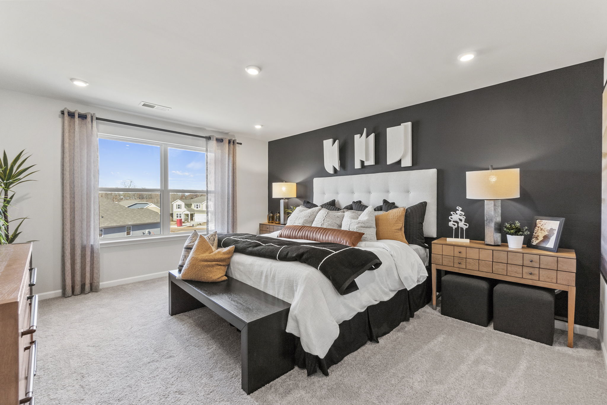 A bedroom with a large bed.