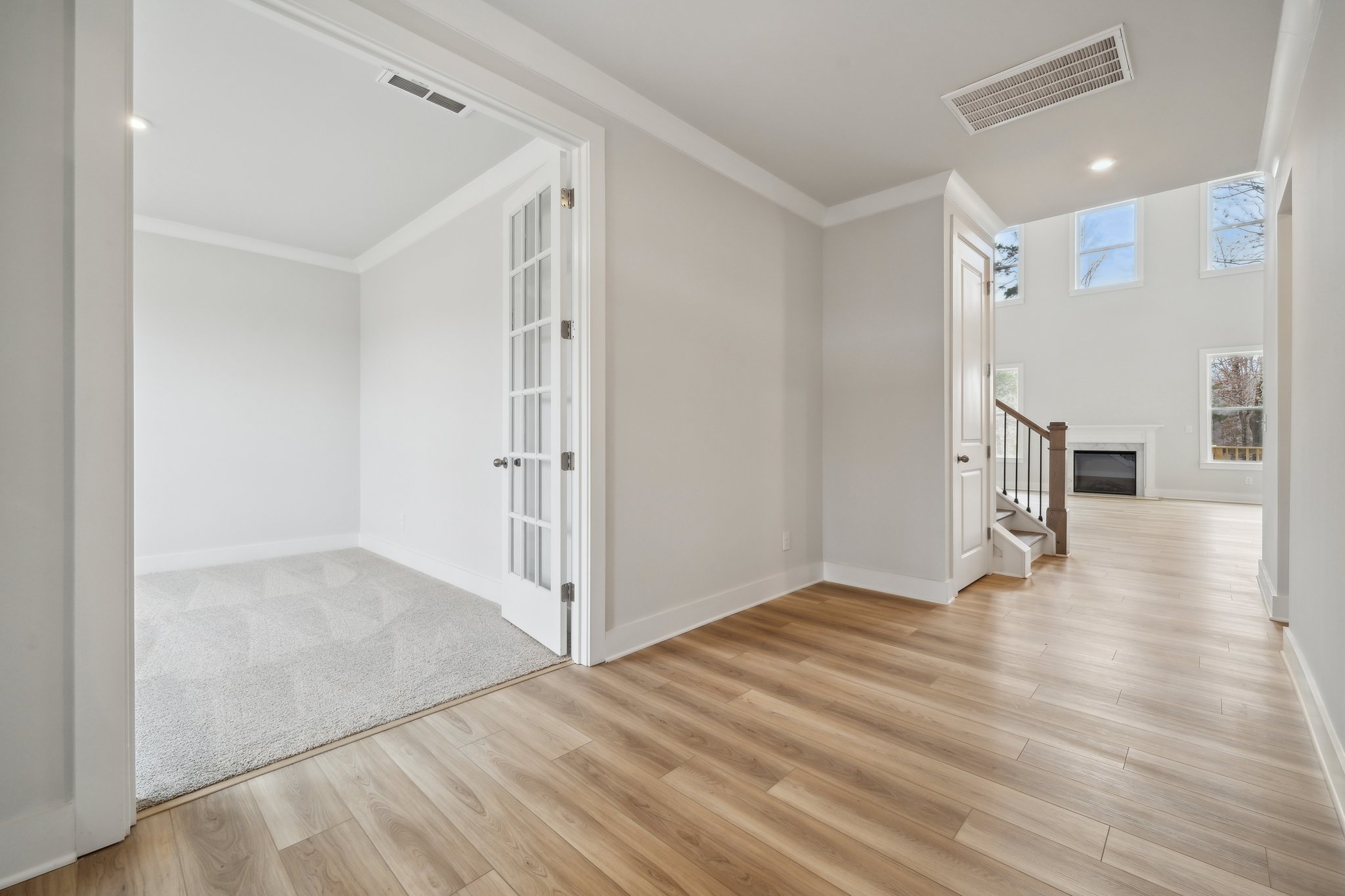 A room with a wood floor and a wood floor.