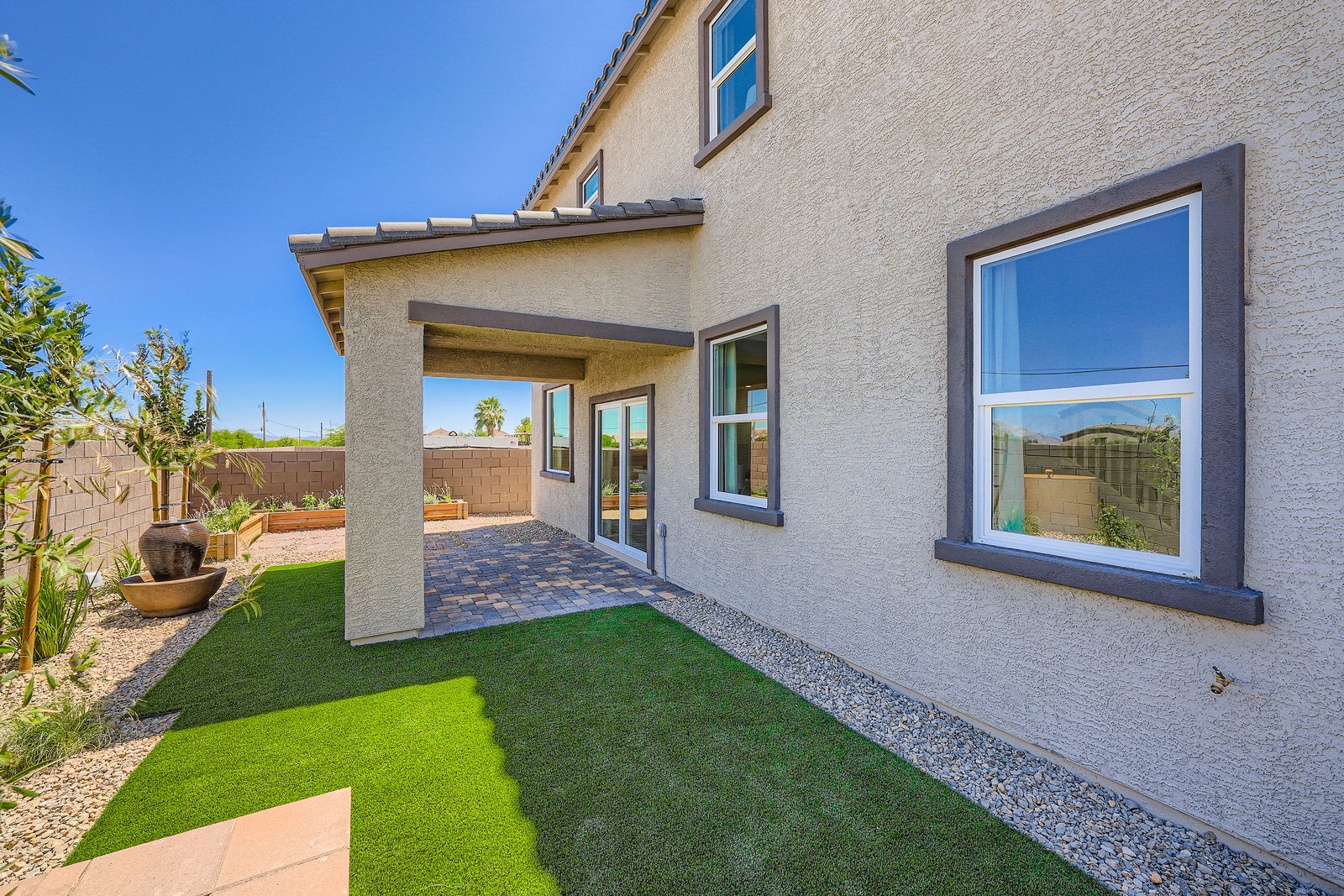 A house with a grass yard.