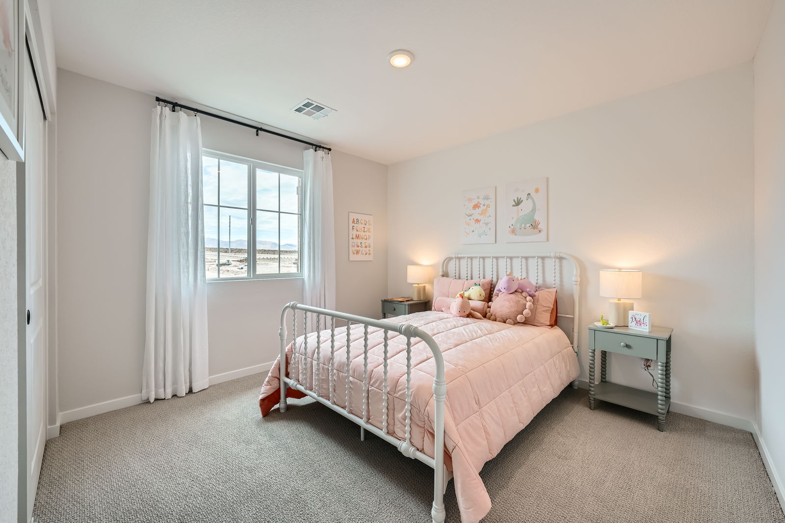 A bedroom with a bed and a window.