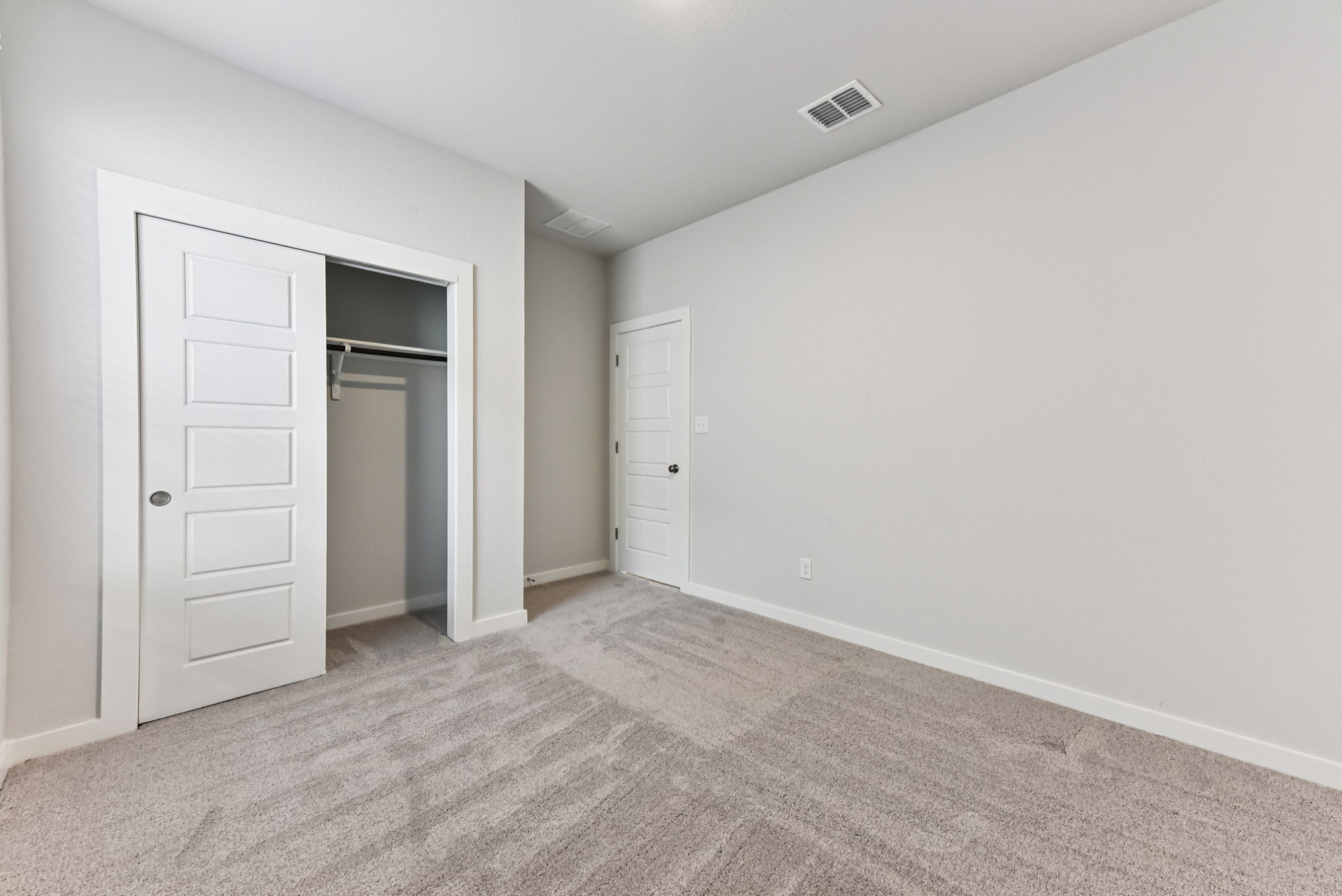 A room with white doors.