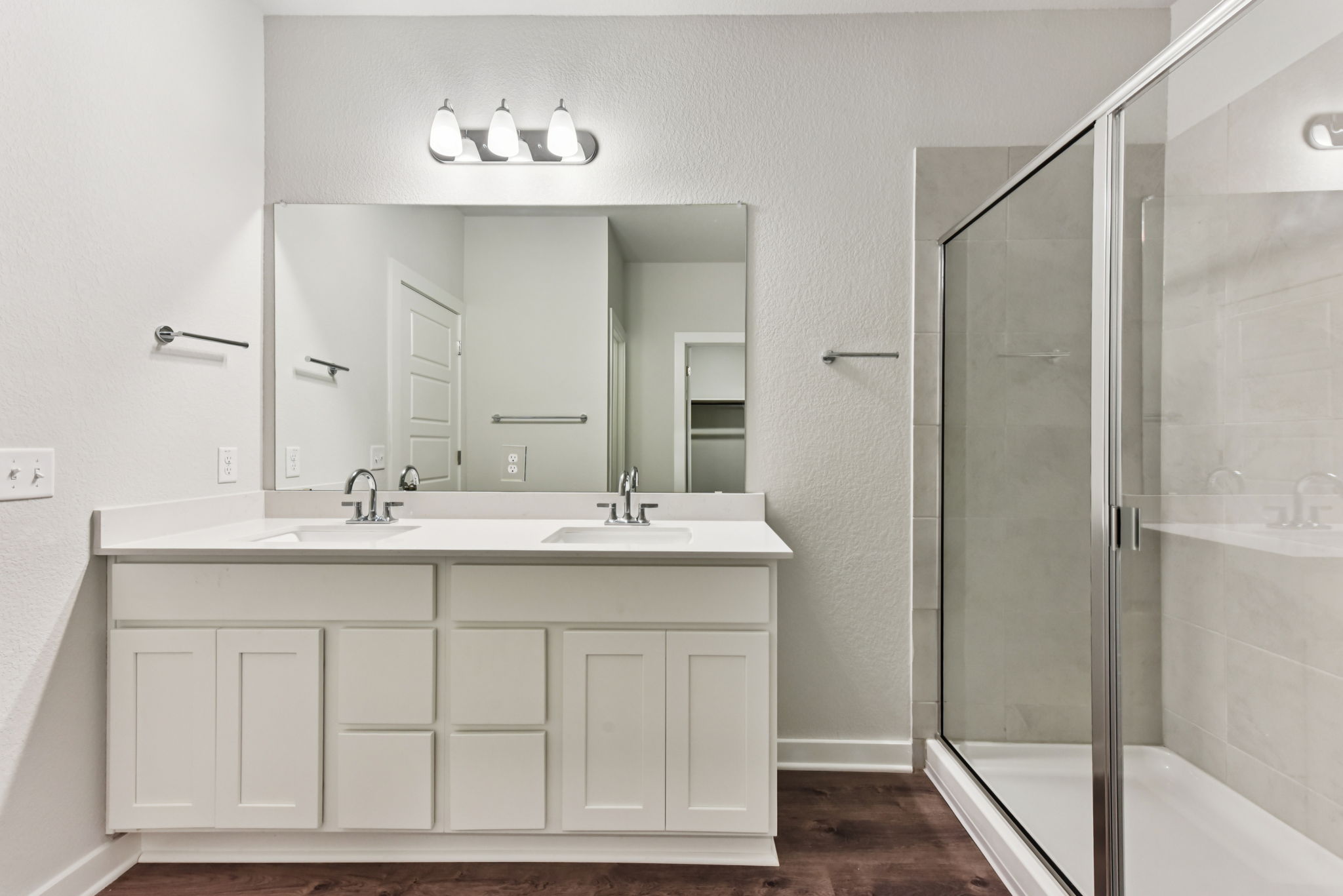 A bathroom with a glass shower.