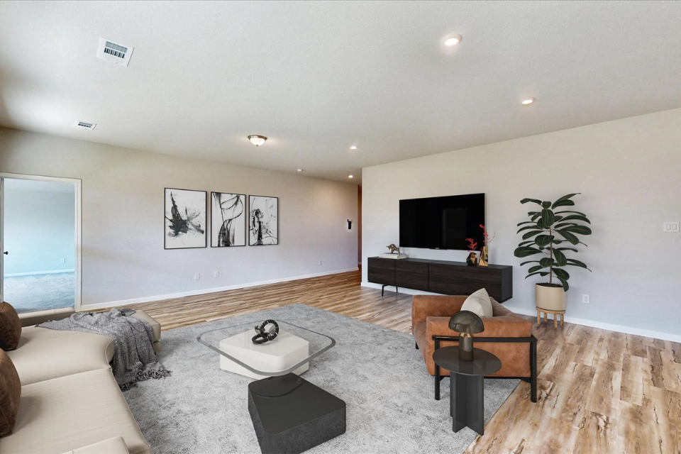 A living room with a tv and couches.