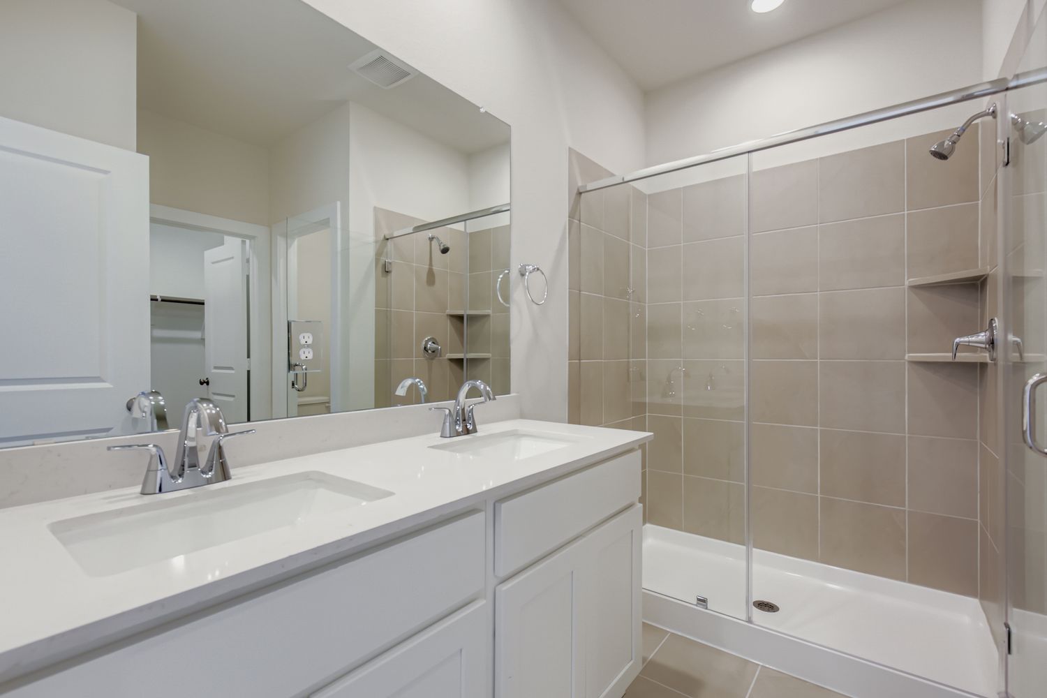 A bathroom with a glass shower.