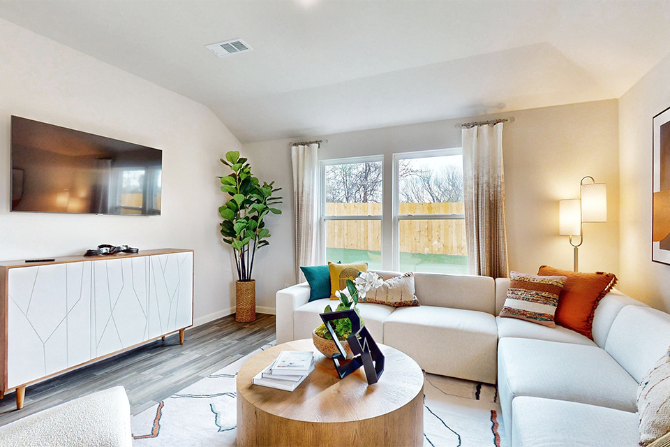 A living room with a couch and a coffee table.