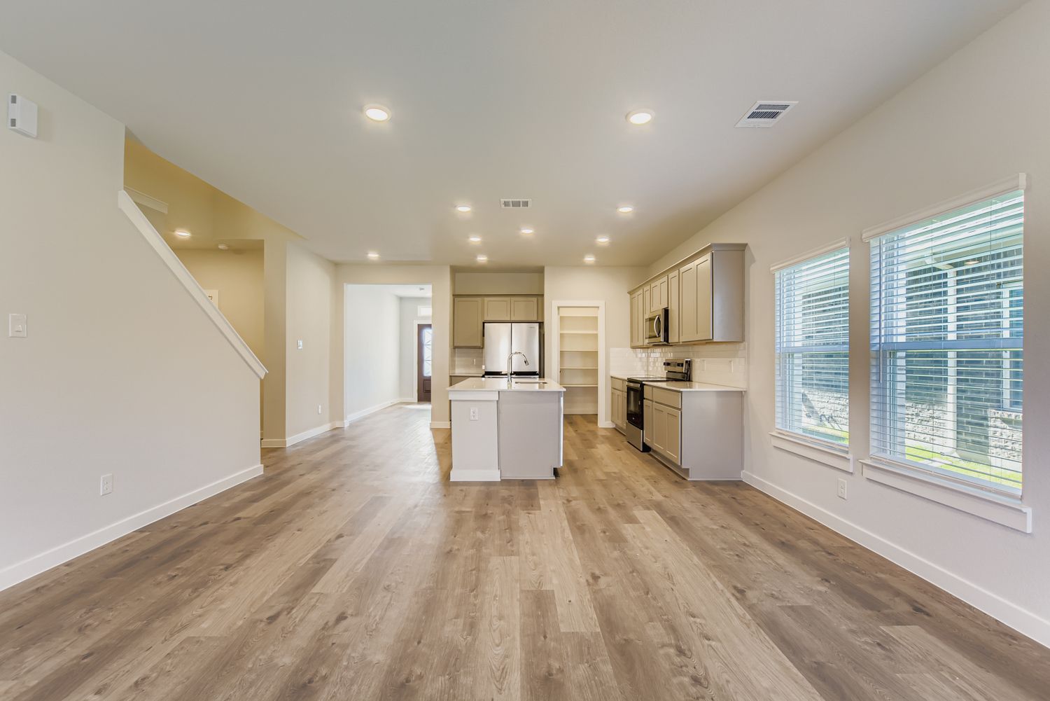 A large empty room with white walls.