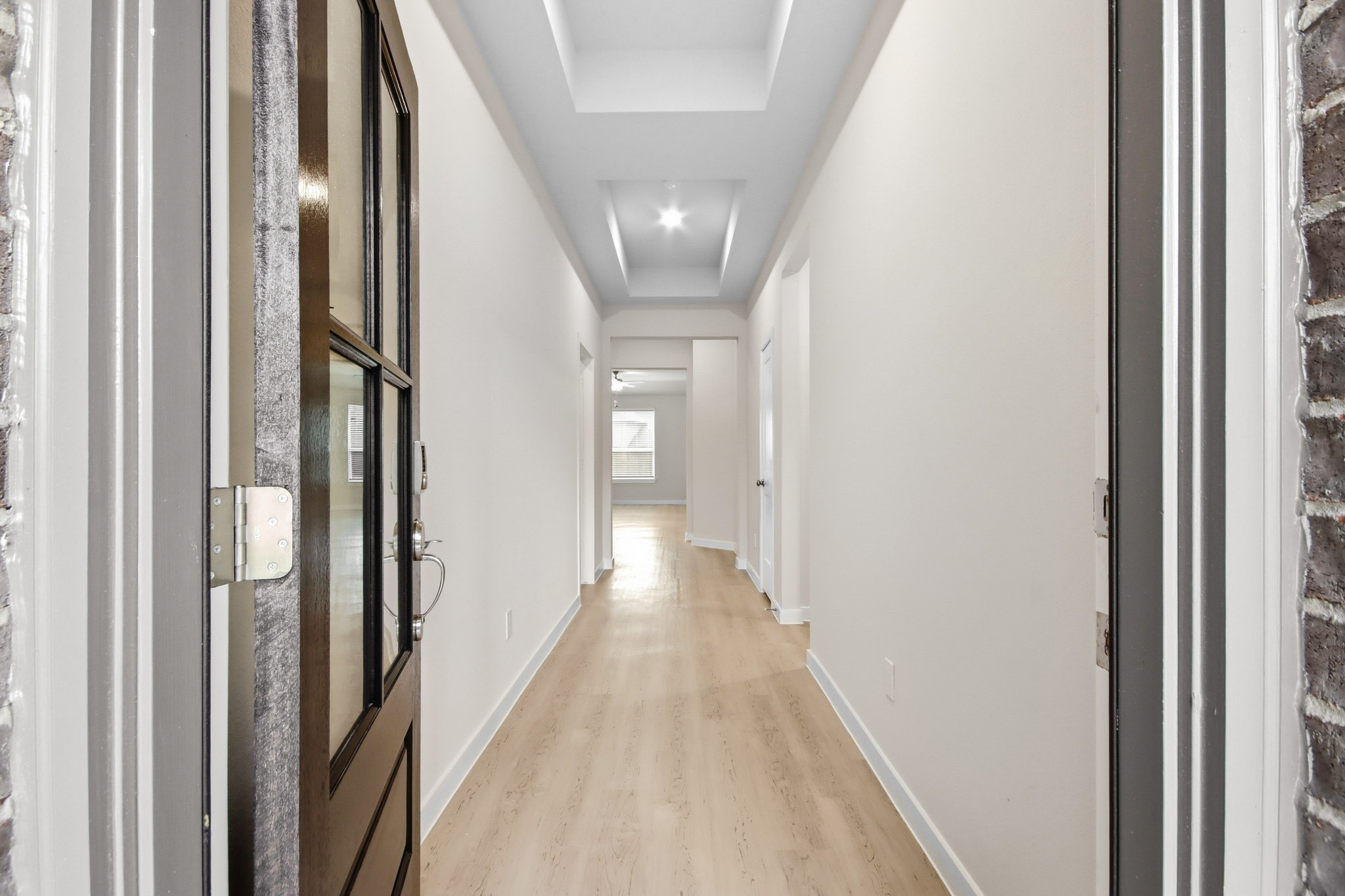 A hallway with white walls.