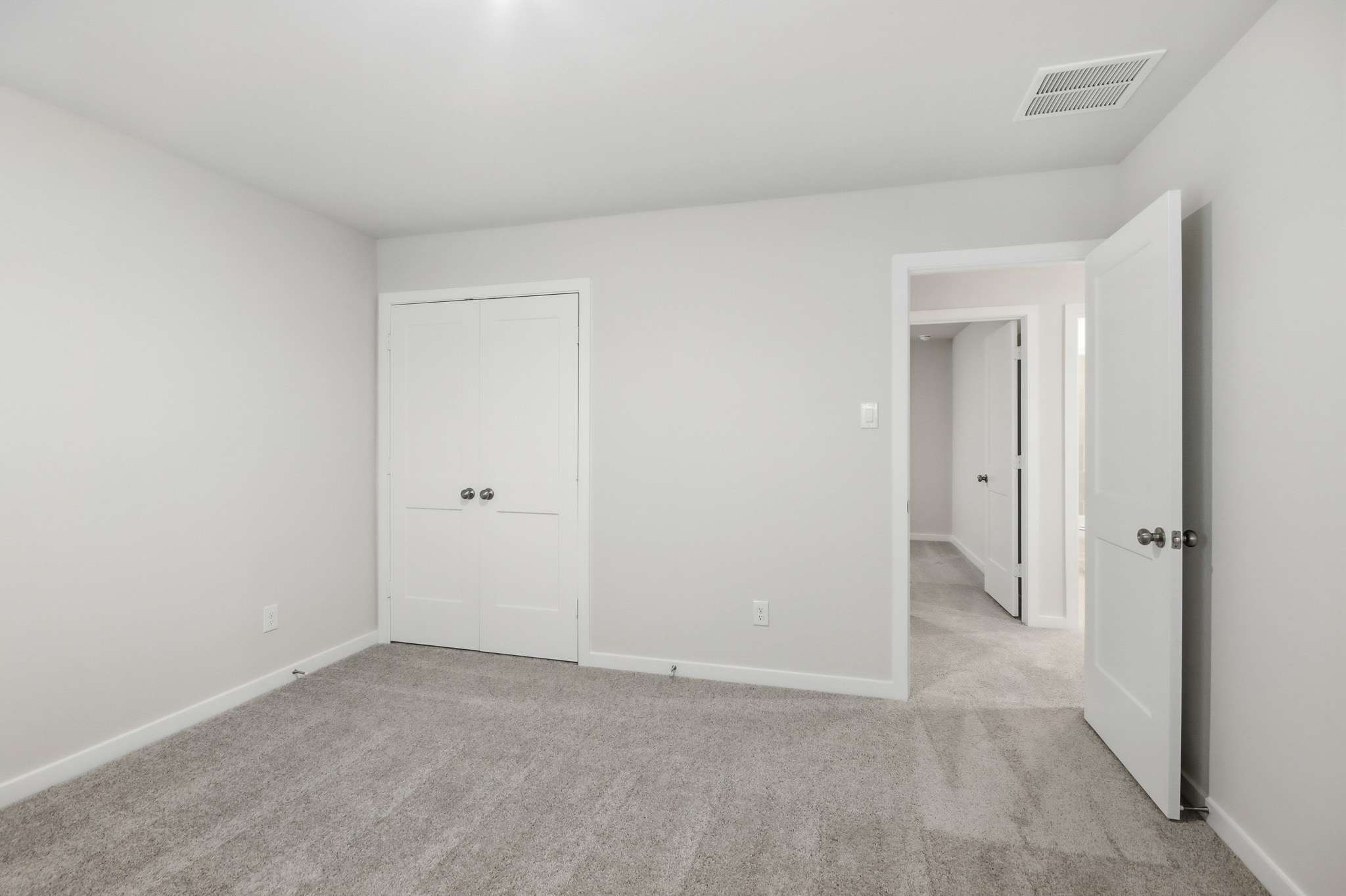 A room with white doors.
