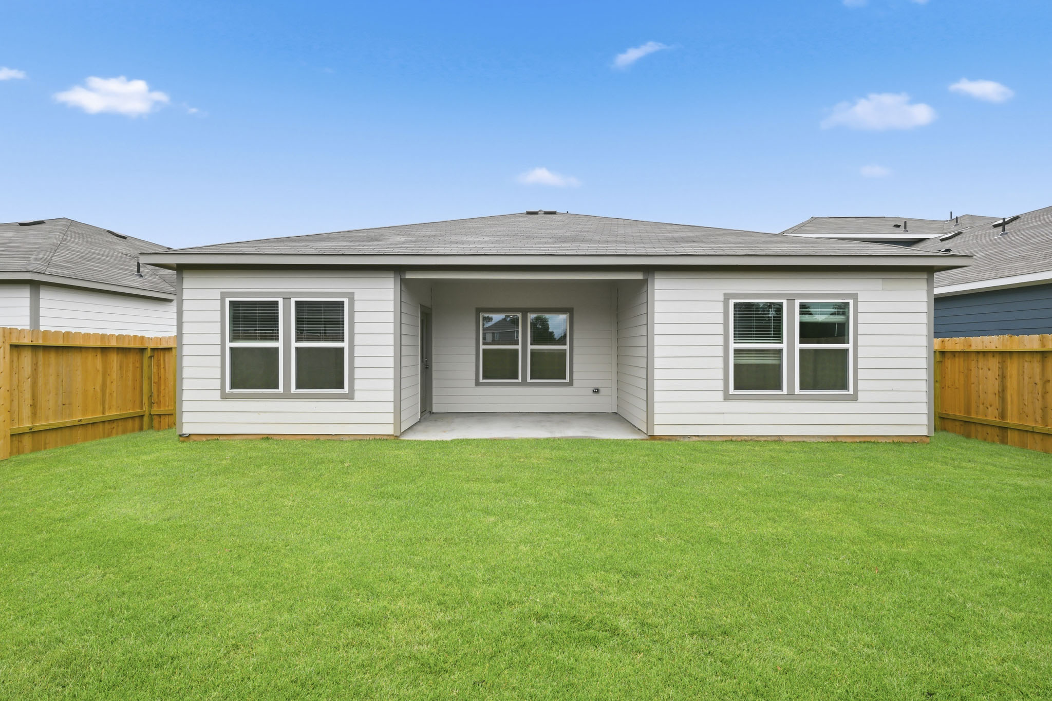 A house with a green lawn.