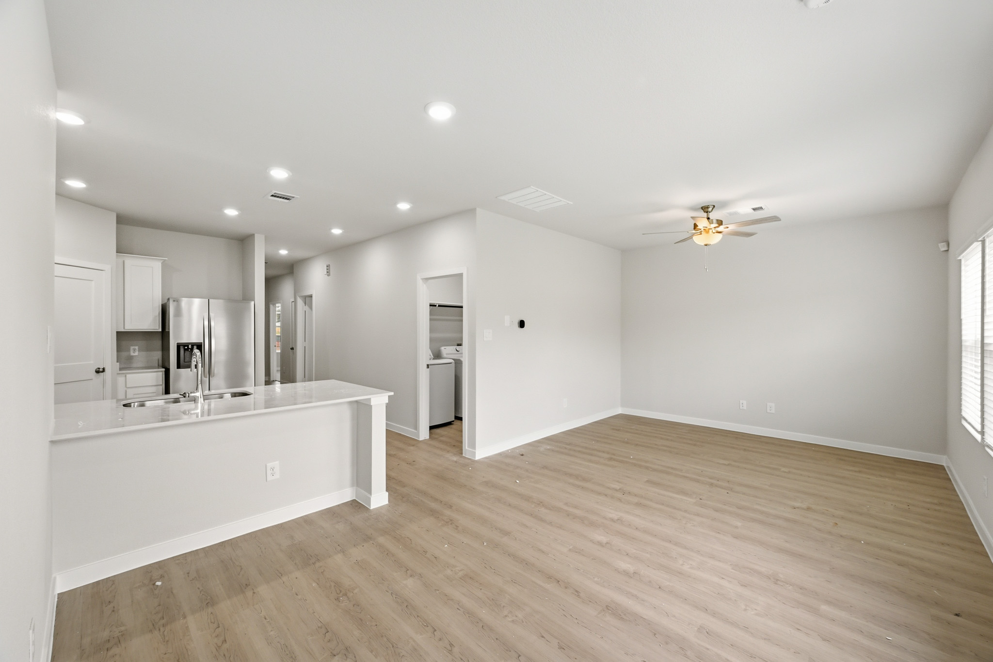 A large kitchen with white cabinets.