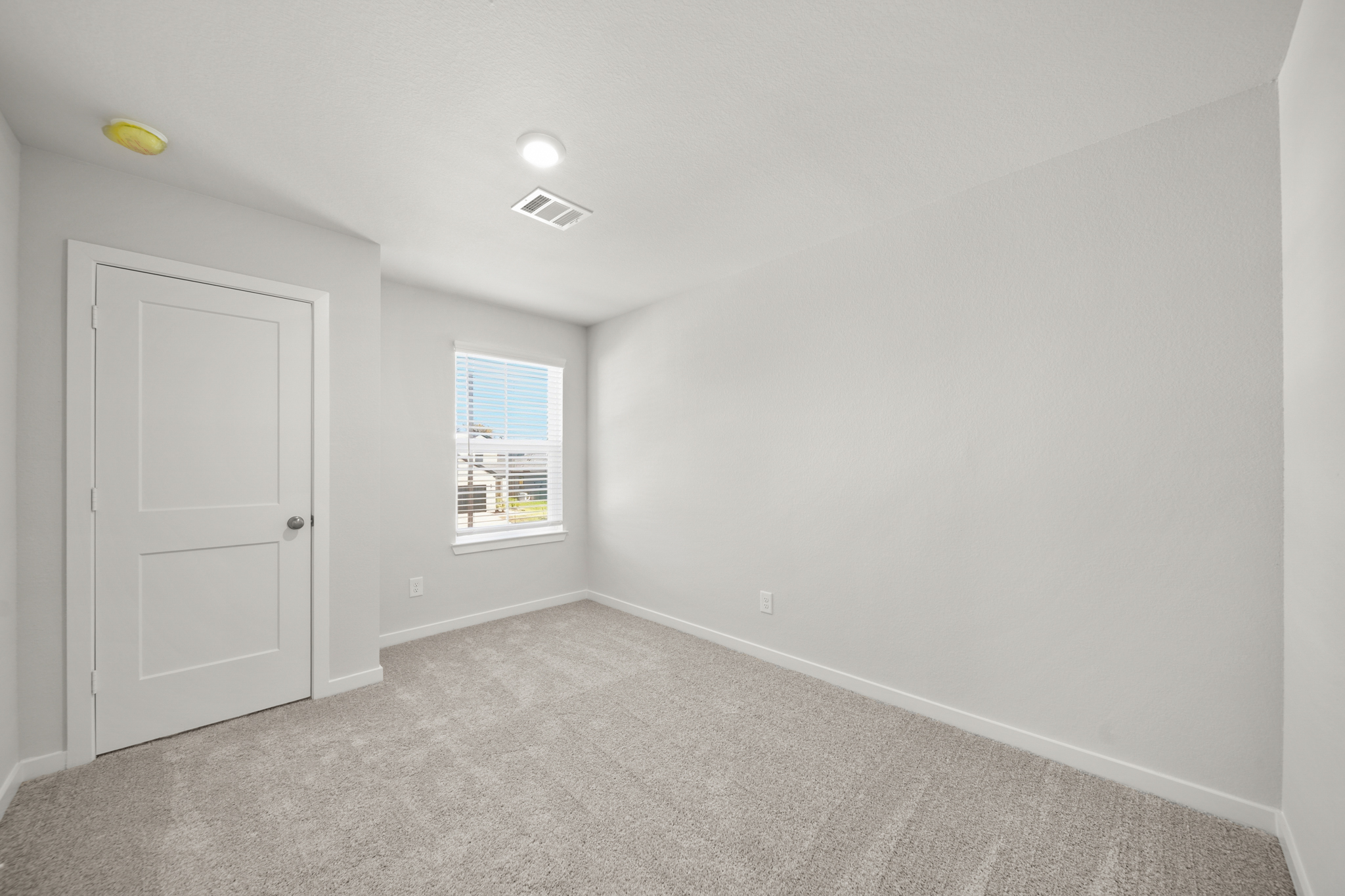 A room with a door and a window.