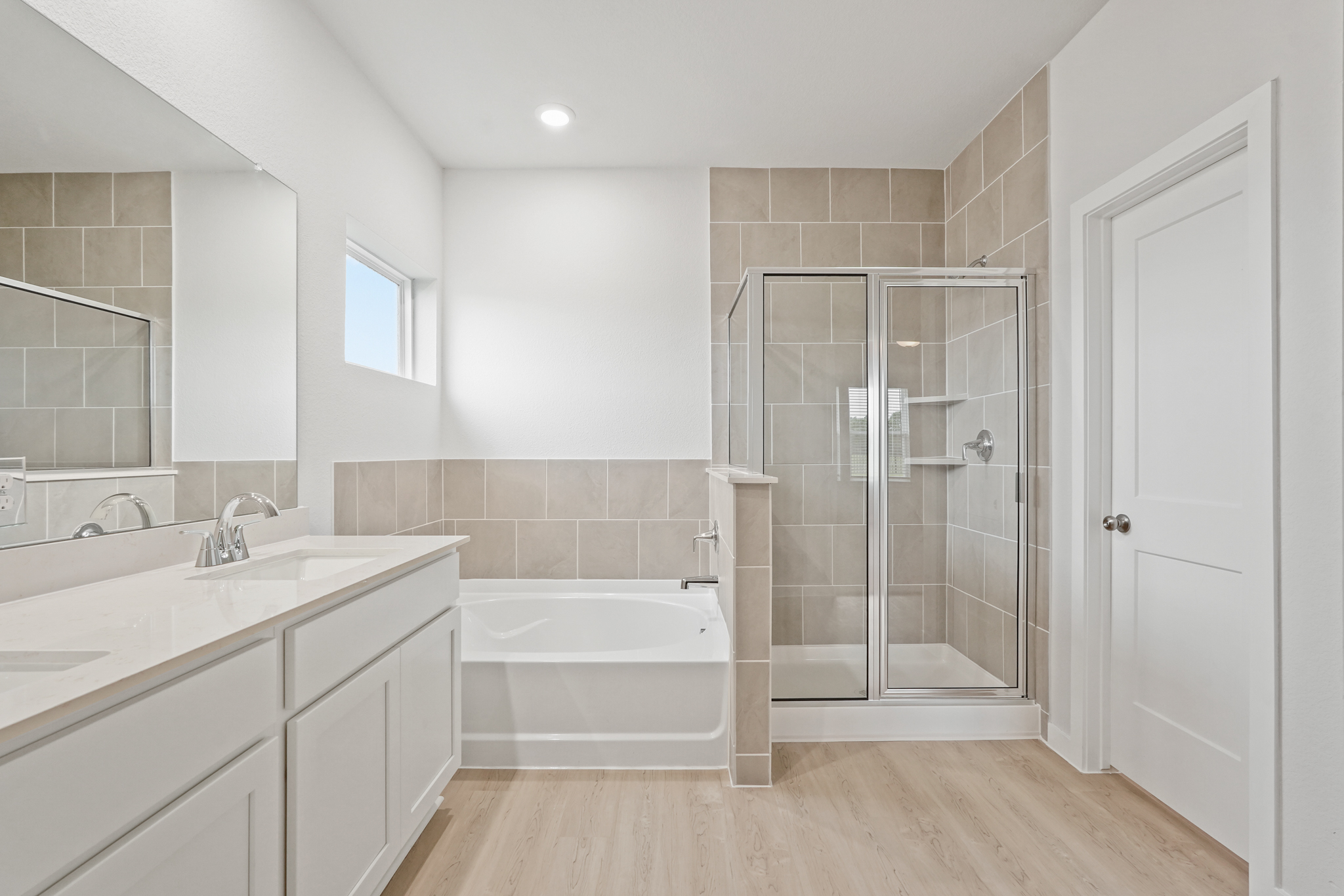 A bathroom with a glass shower.