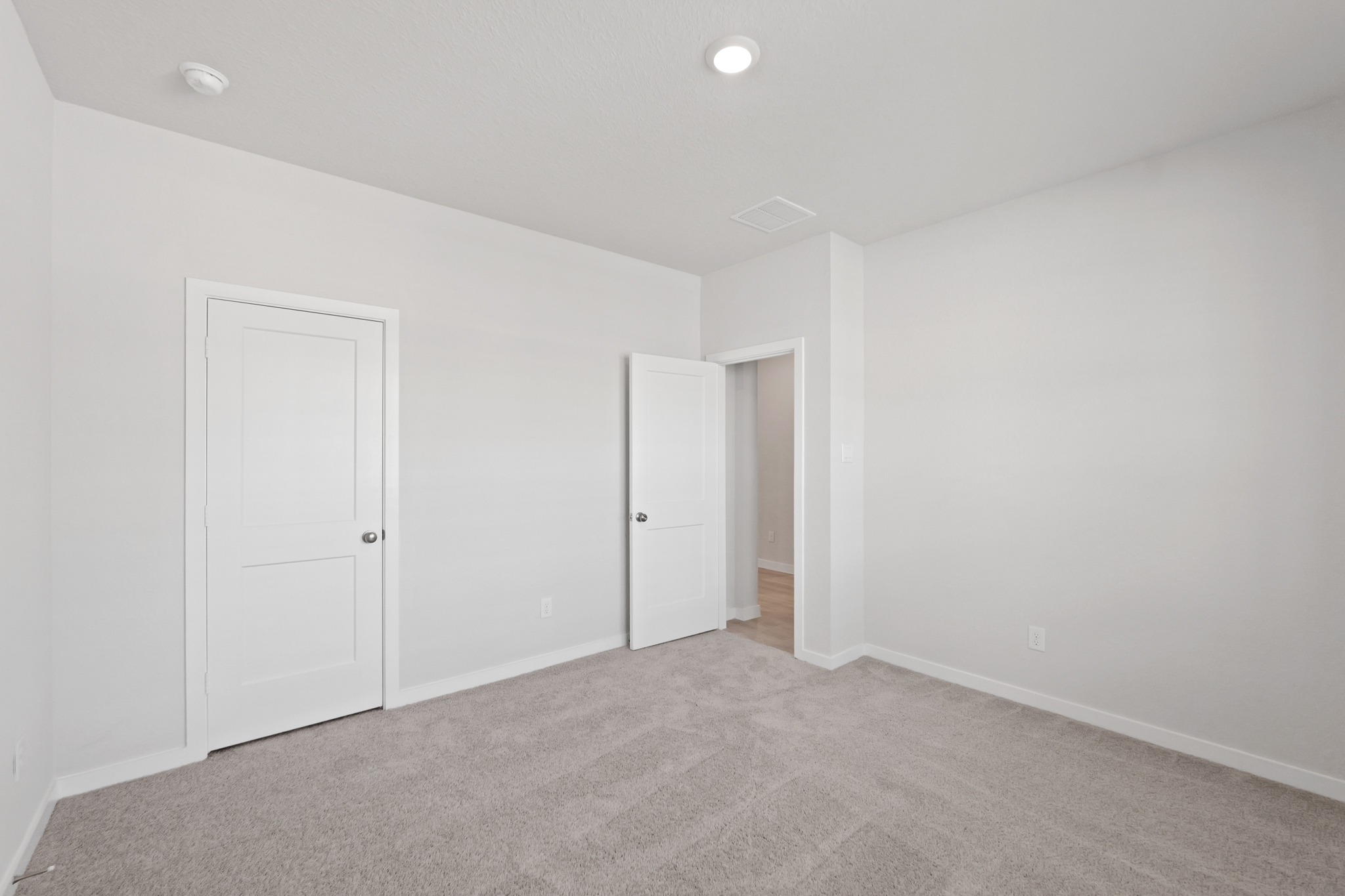 A room with white doors.