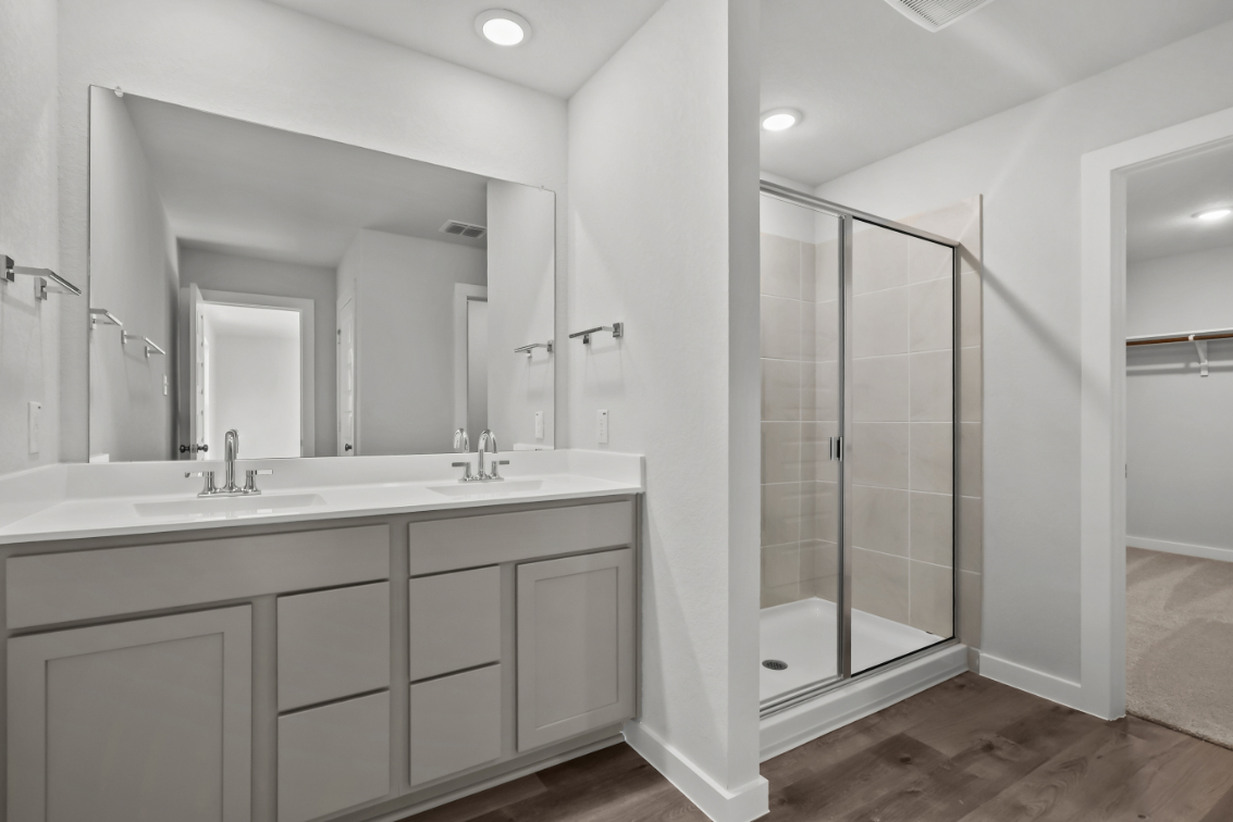 A bathroom with a glass shower.