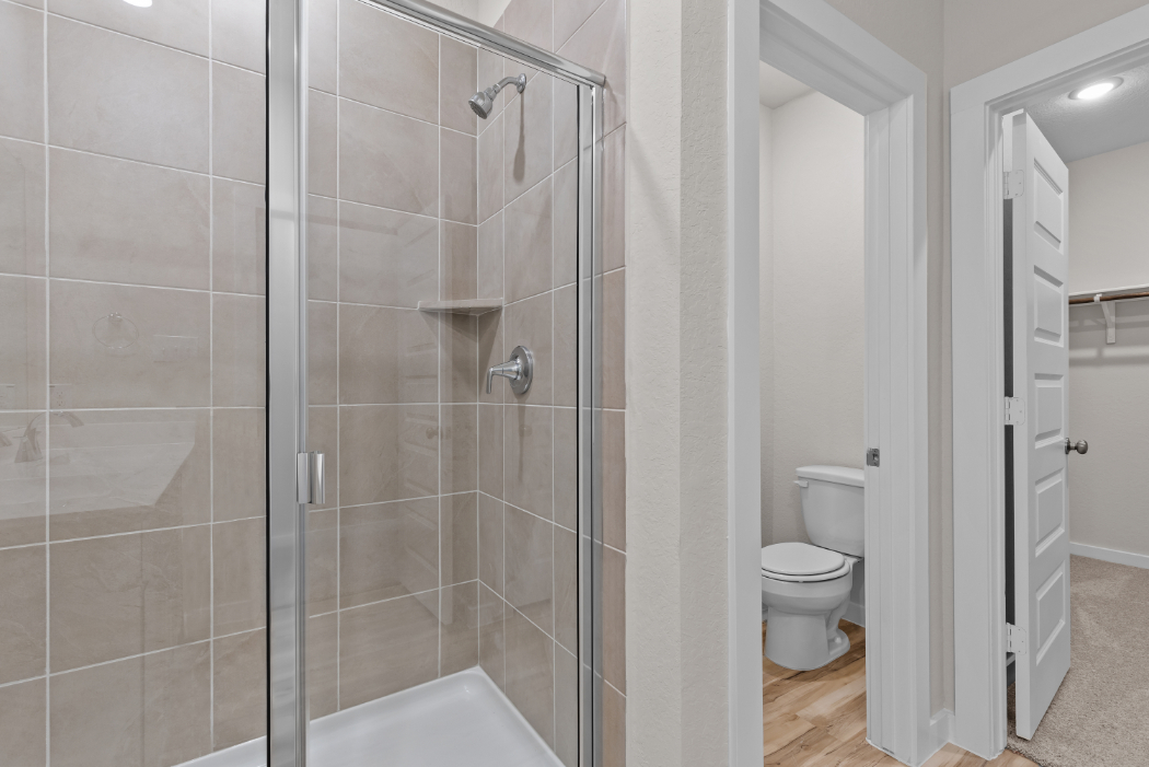 A bathroom with a glass shower.