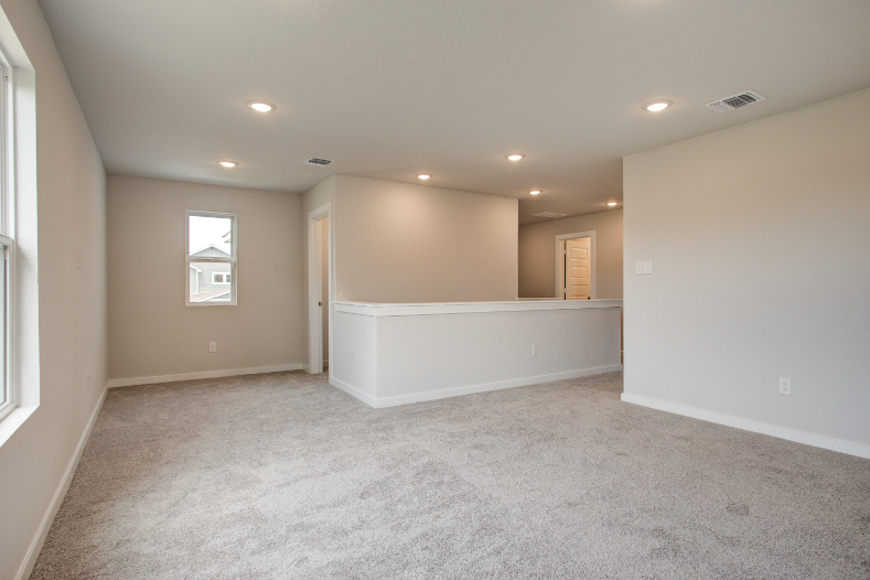 A room with a white wall and a white floor.