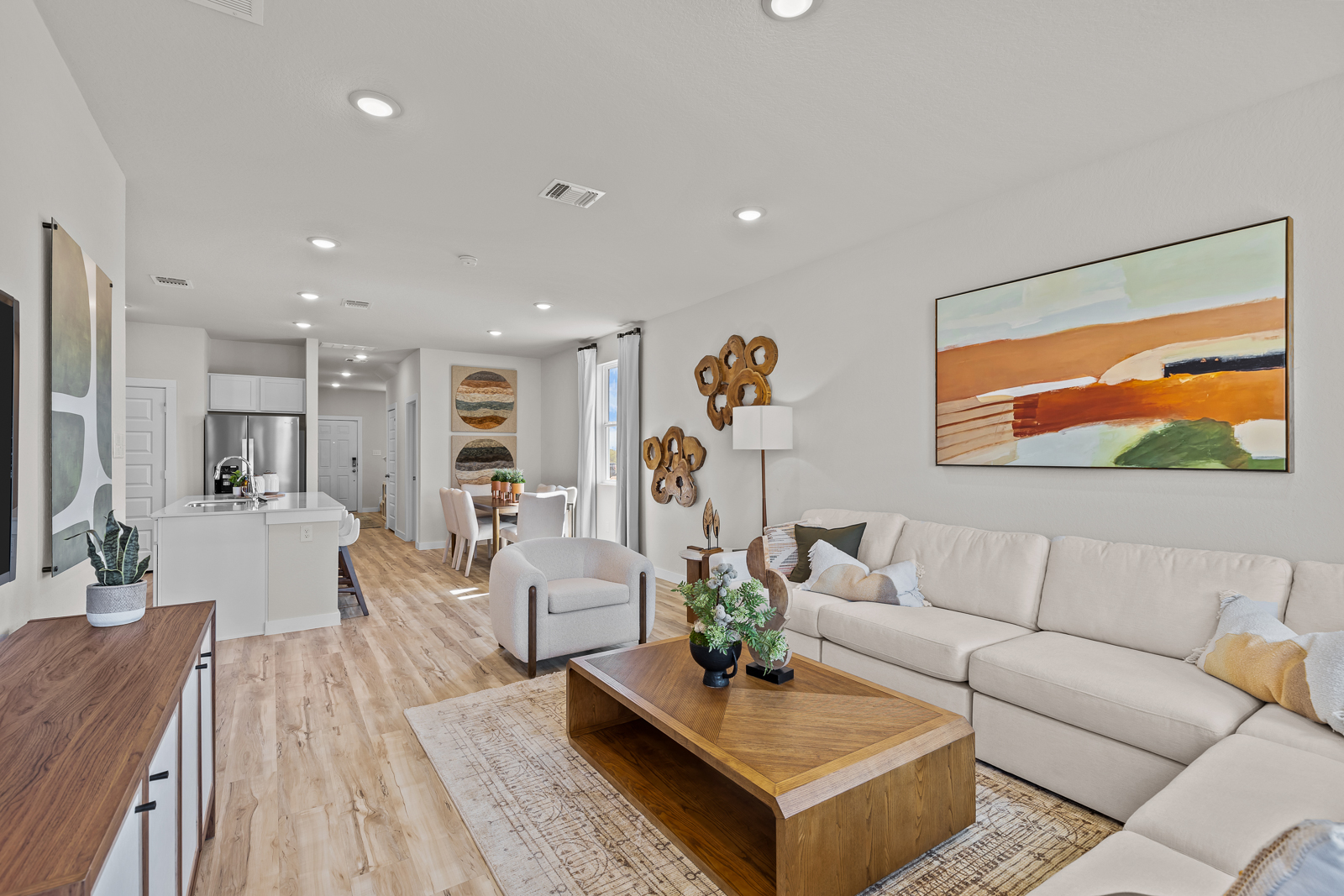 A living room with a wood floor.
