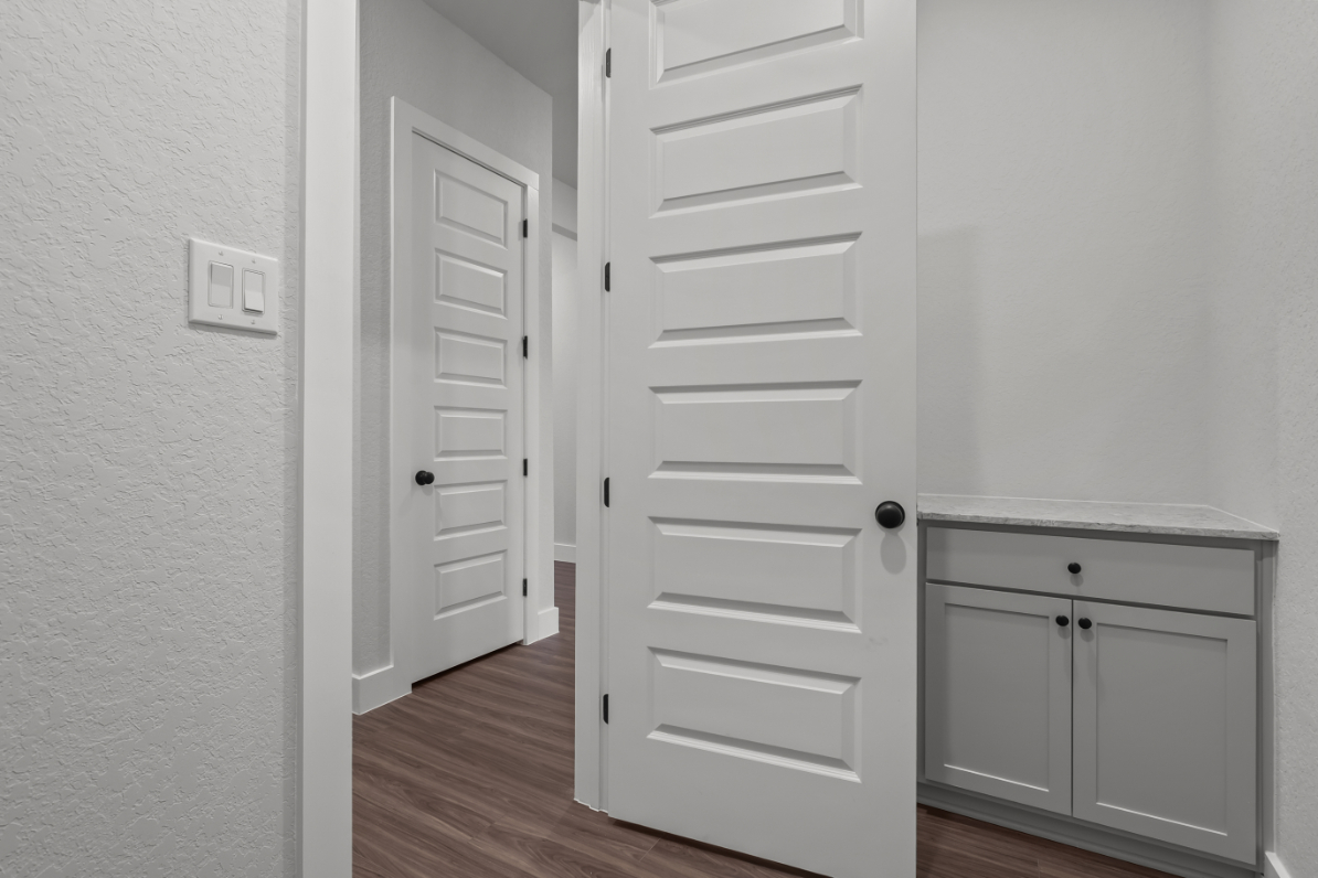A white door in a room.