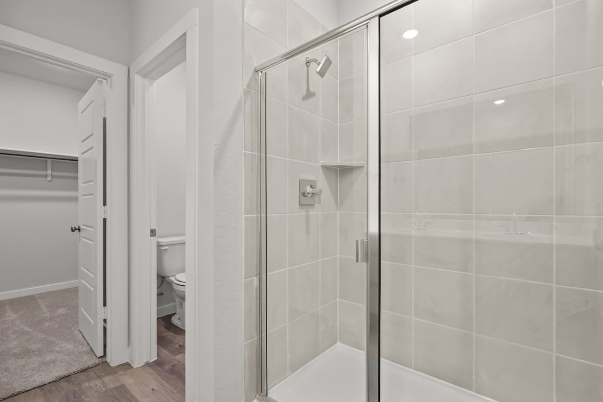 A bathroom with a glass shower.