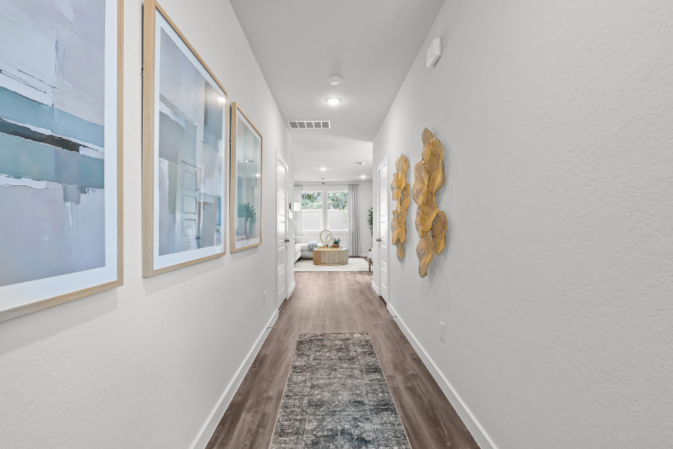 A hallway with white walls.