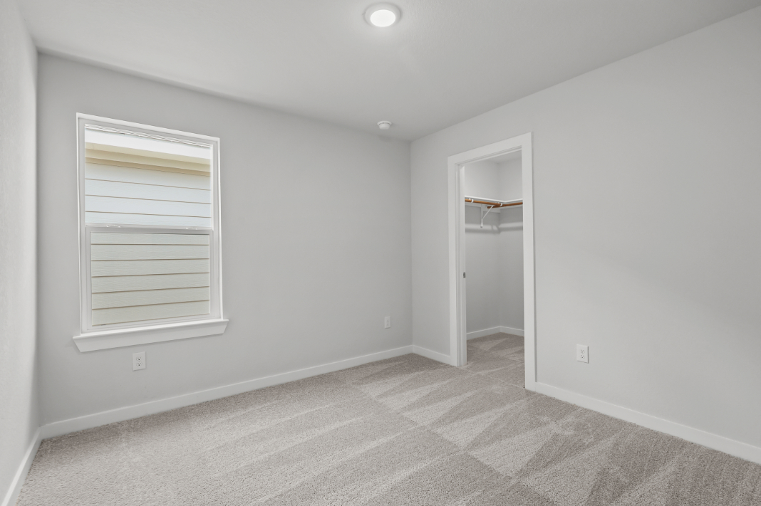 A room with a door and a window.