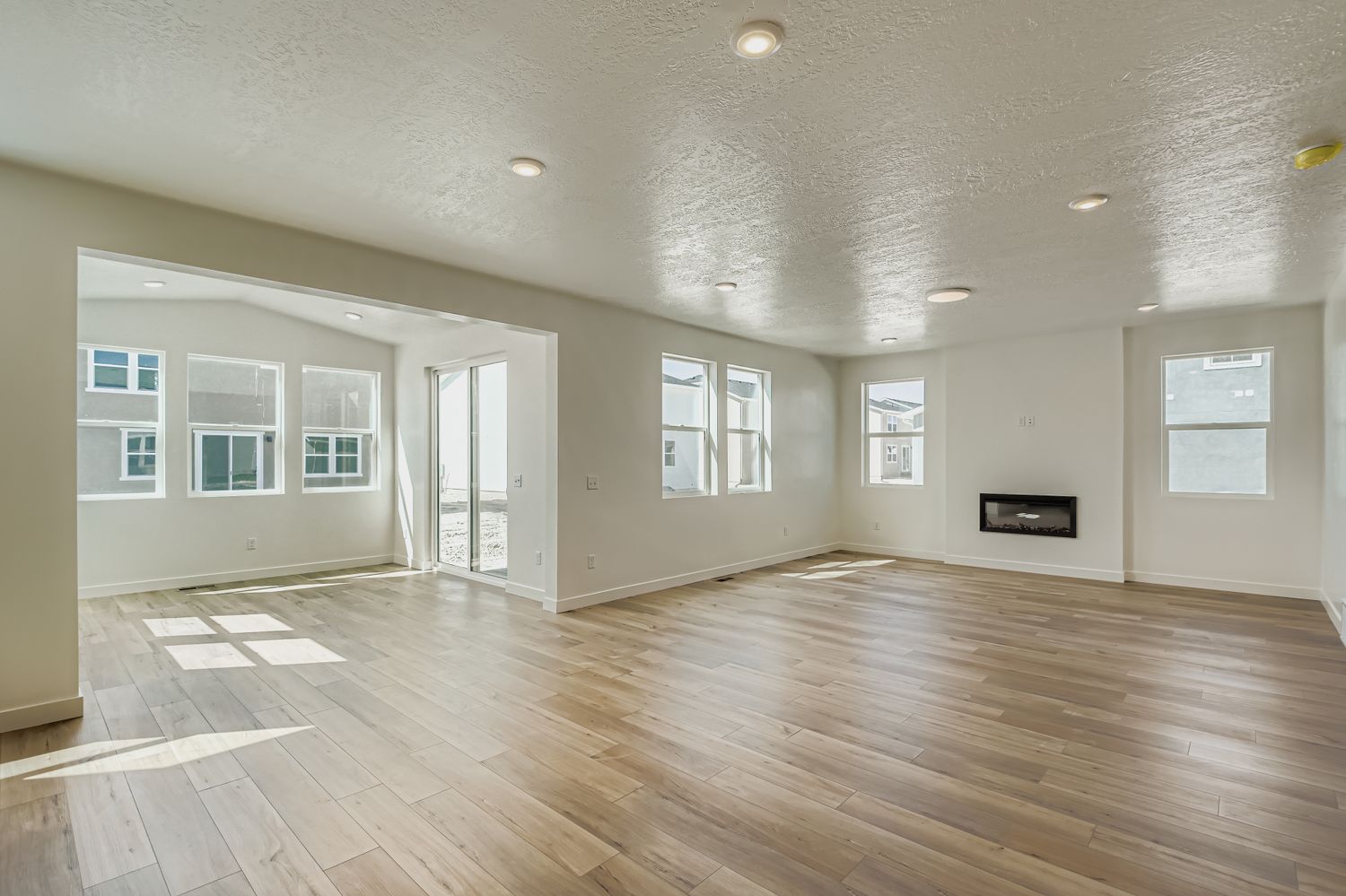 A large empty room with white walls.