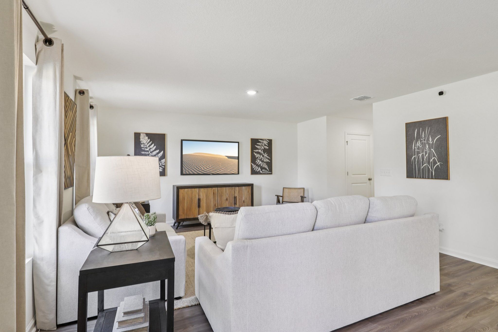 A living room with a white couch.